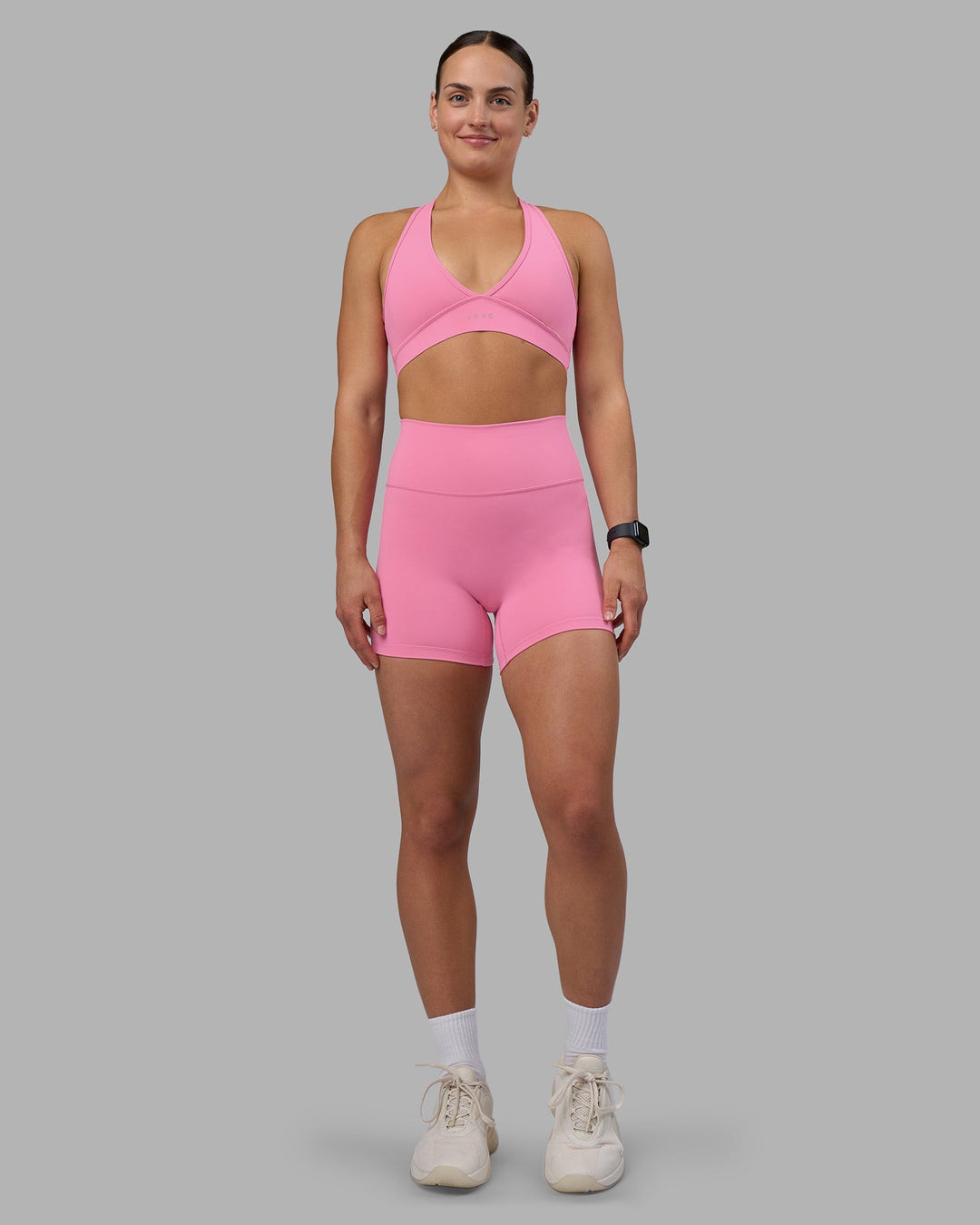 Woman wearing Fusion Ultra High-Rise 4&quot; Short - Candy Pink | Model:Keisha | Size:S