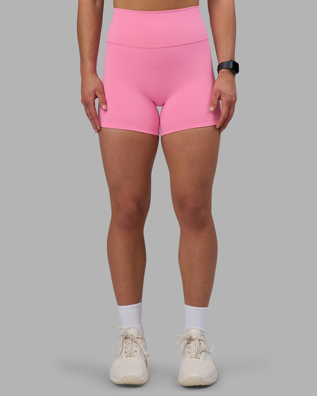 Woman wearing Fusion Ultra High-Rise 4&quot; Short - Candy Pink | Model:Keisha | Size:S