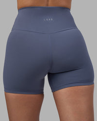 Woman wearing Fusion Ultra High-Rise 4" Short - Night Shadow | Model:Rhiley | Size:S
