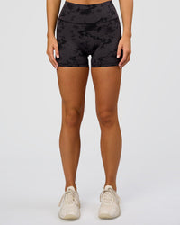 Woman wearing Fusion Ultra High-Rise 4" Short Pockets - Black Tie Dye | Set:true | Angle:front | Model:Amity | Size:S | Thumbnail Index: 1