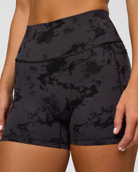 Woman wearing Fusion Ultra High-Rise 4" Short Pockets - Black Tie Dye | Model:Amity | Size:S