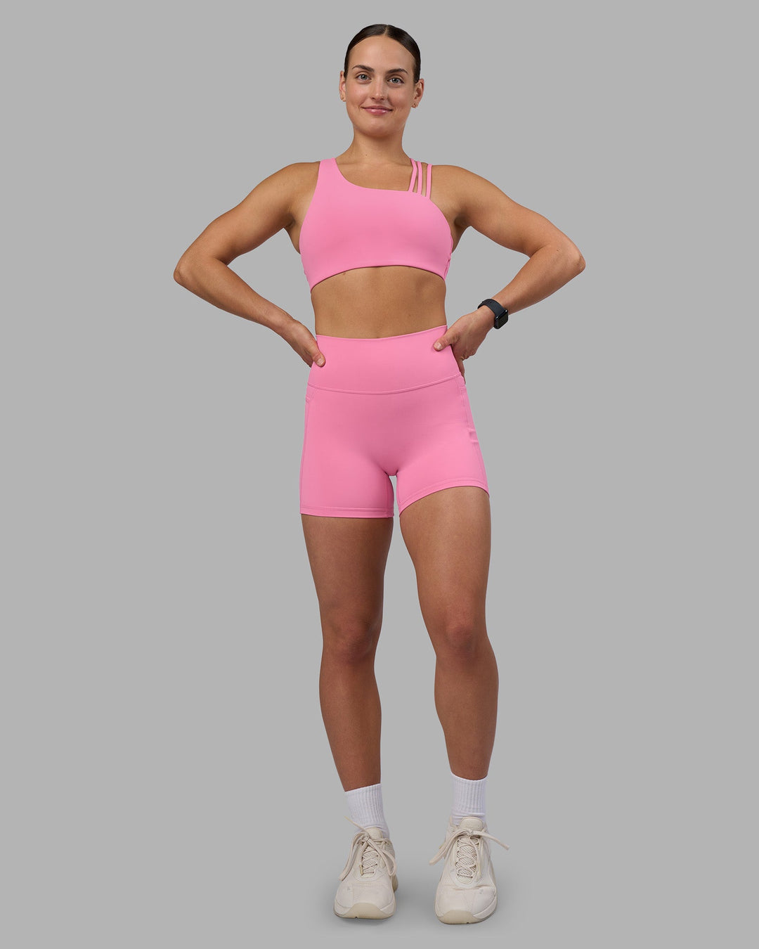 Woman wearing Fusion Ultra High-Rise 4&quot; Short Pockets - Candy Pink | Model:Keisha | Size:S