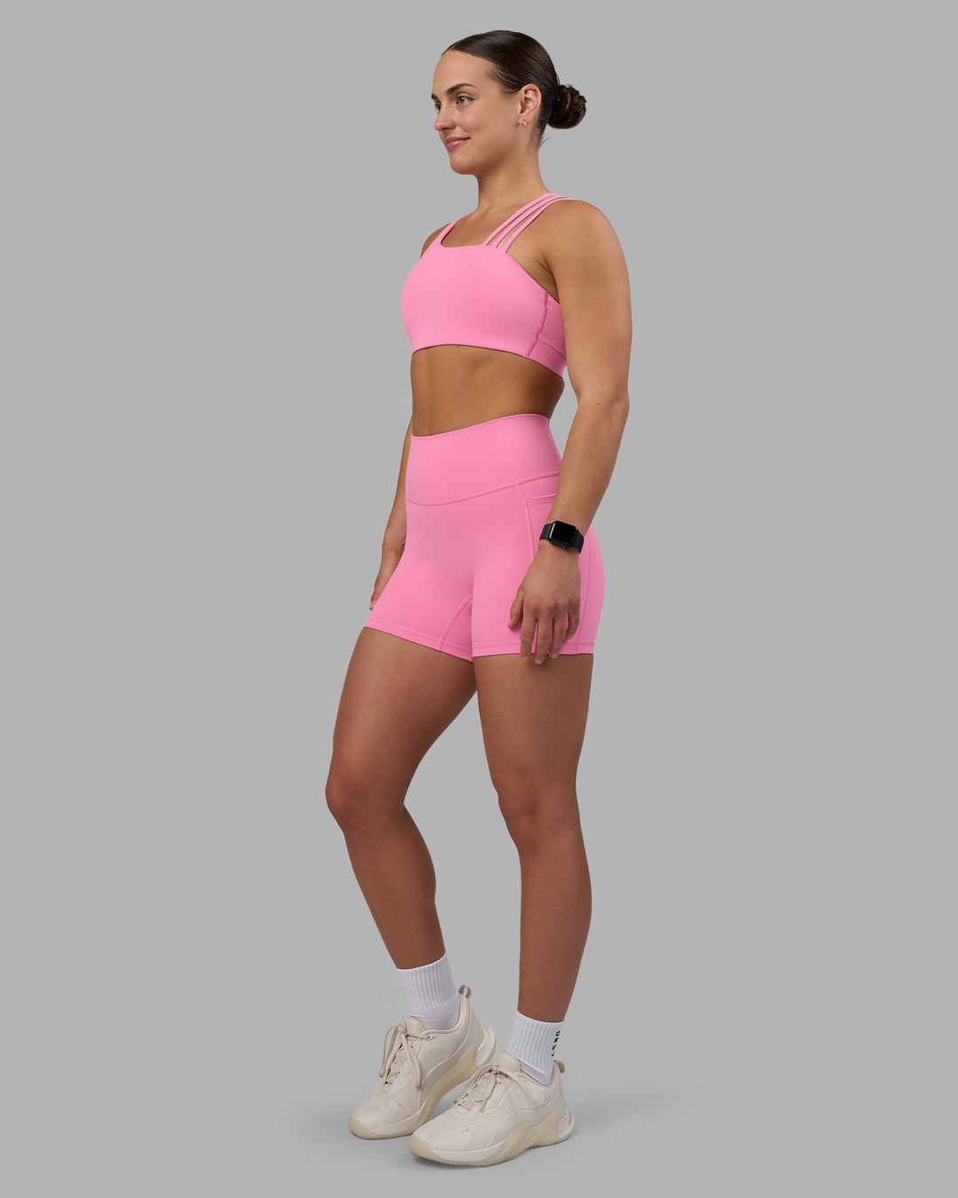 Woman wearing Fusion Ultra High-Rise 4&quot; Short Pockets - Candy Pink | Model:Keisha | Size:S