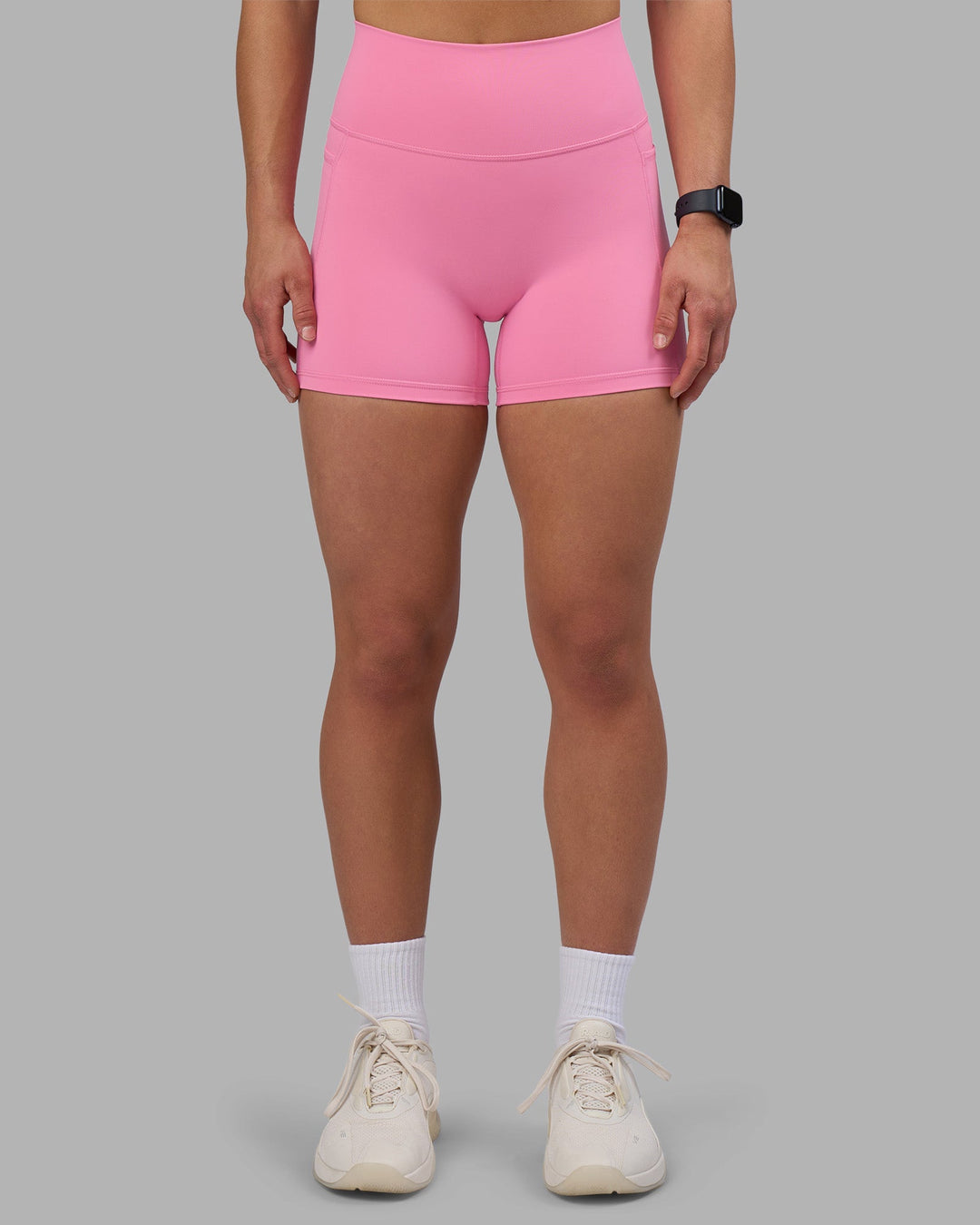 Woman wearing Fusion Ultra High-Rise 4&quot; Short Pockets - Candy Pink | Model:Keisha | Size:S