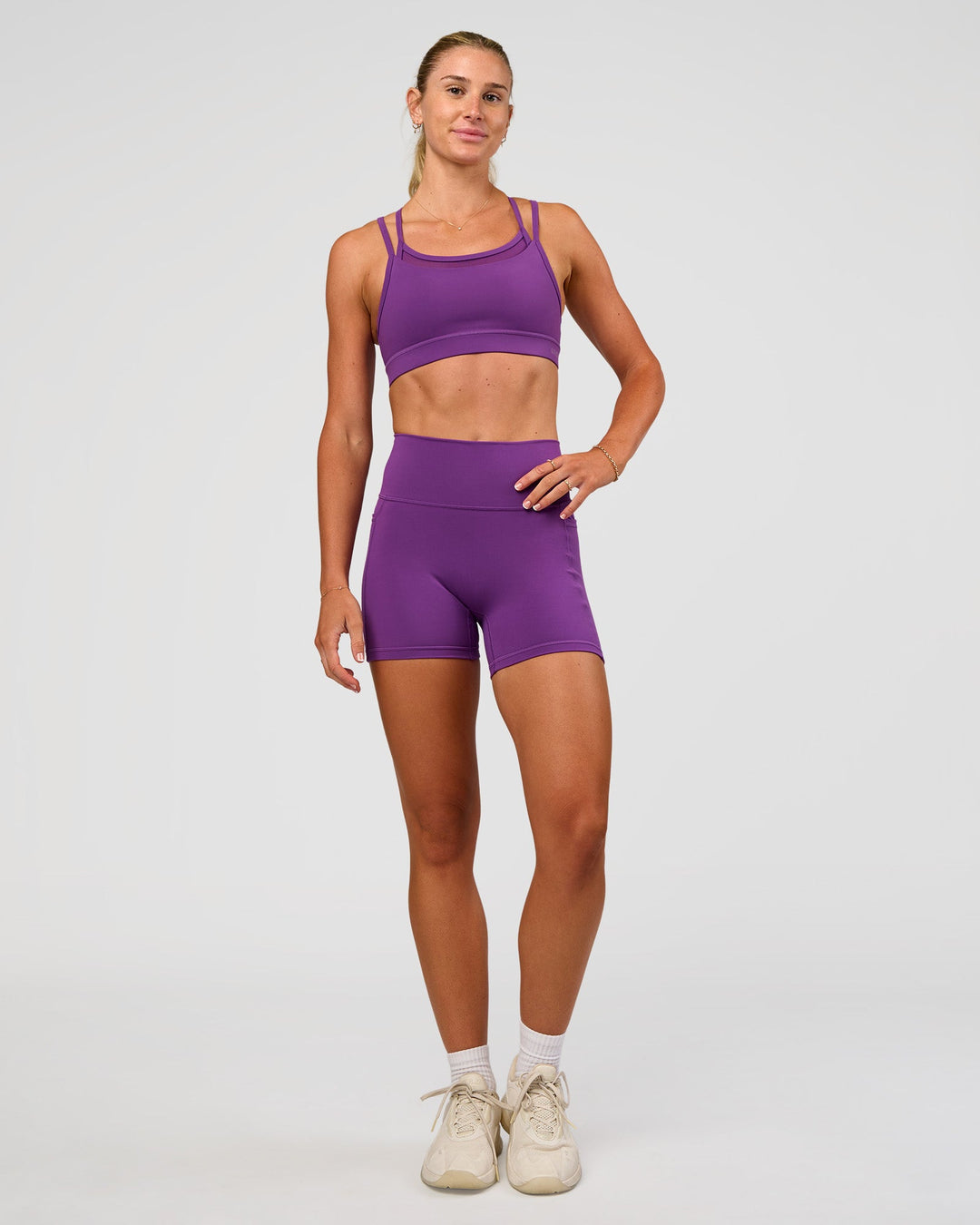 Woman wearing Fusion Ultra High-Rise 4" Short Pockets - Fresh Purple | Model:Emelia | Size:S