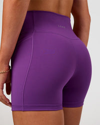 Woman wearing Fusion Ultra High-Rise 4" Short Pockets - Fresh Purple | Model:Emelia | Size:S