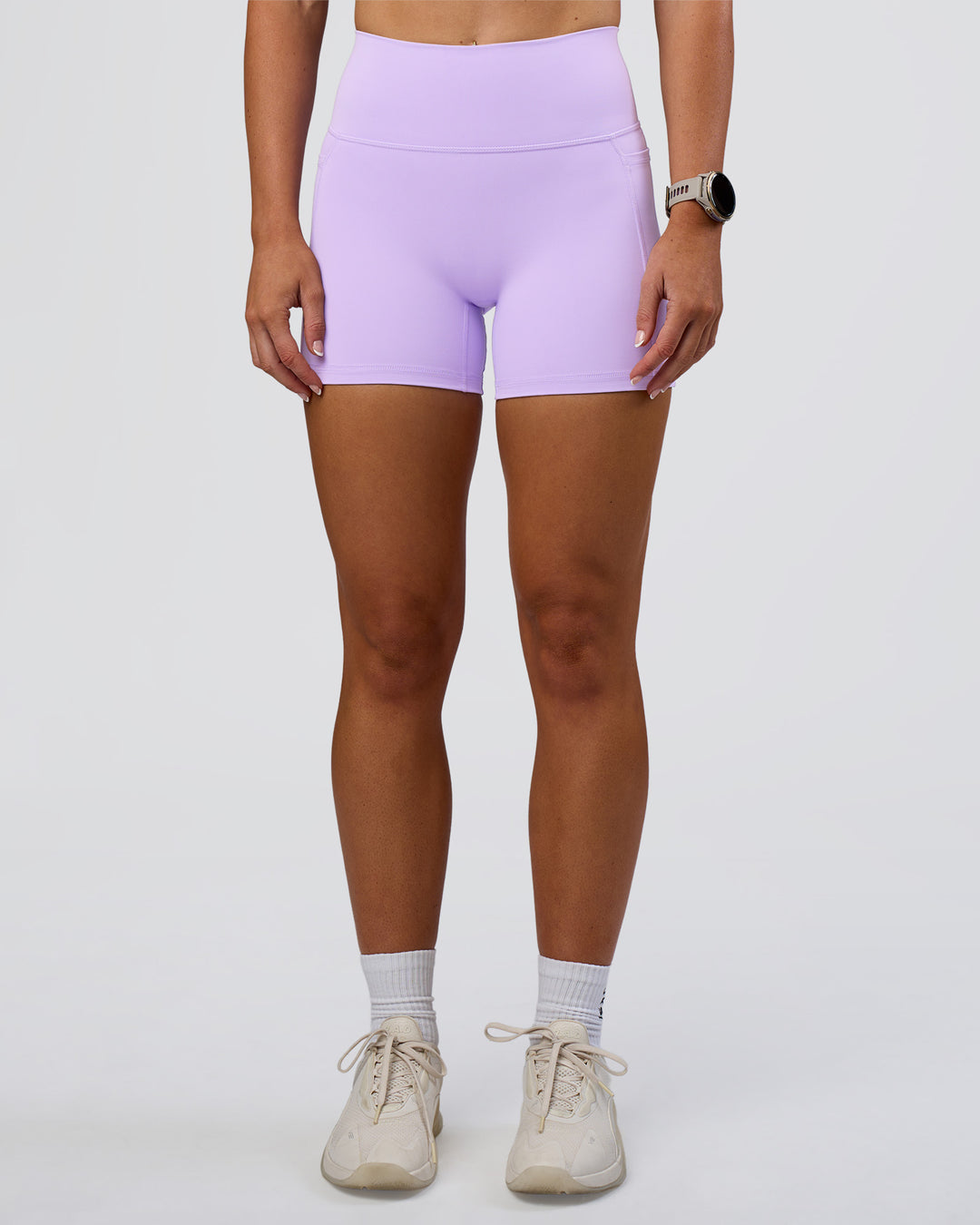Woman wearing Fusion Ultra High-Rise 4&quot; Short Pockets - Pale Lilac | Model:Emelia | Size:S