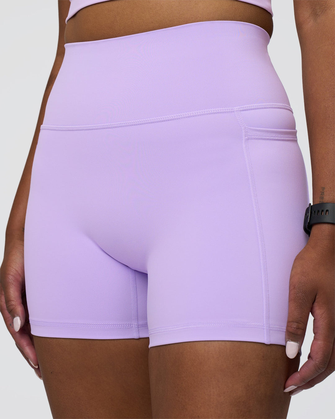 Woman wearing Fusion Ultra High-Rise 4&quot; Short Pockets - Pale Lilac | Model:Rica | Size:S
