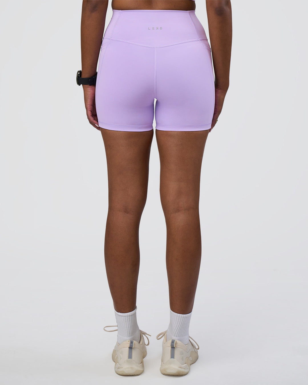 Woman wearing Fusion Ultra High-Rise 4&quot; Short Pockets - Pale Lilac | Model:Rica | Size:S