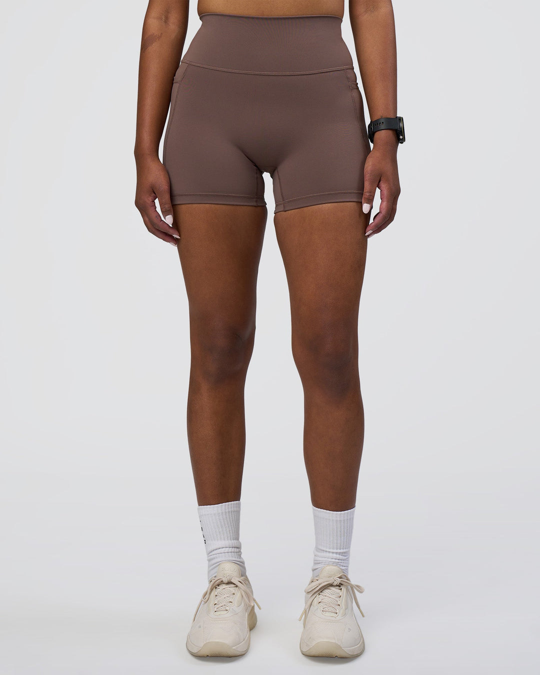 Woman wearing Fusion Ultra High-Rise 4&quot; Short Pockets - Peppercorn | Model:Rica | Size:S