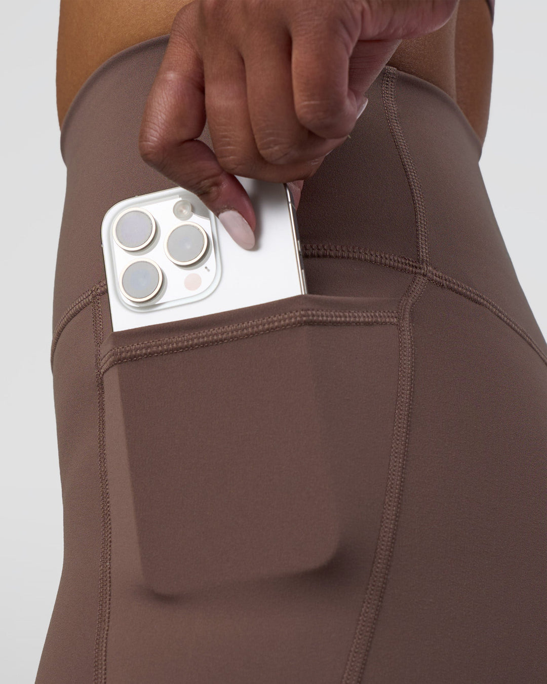 Woman wearing Fusion Ultra High-Rise 4&quot; Short Pockets - Peppercorn | Model:Rica | Size:S