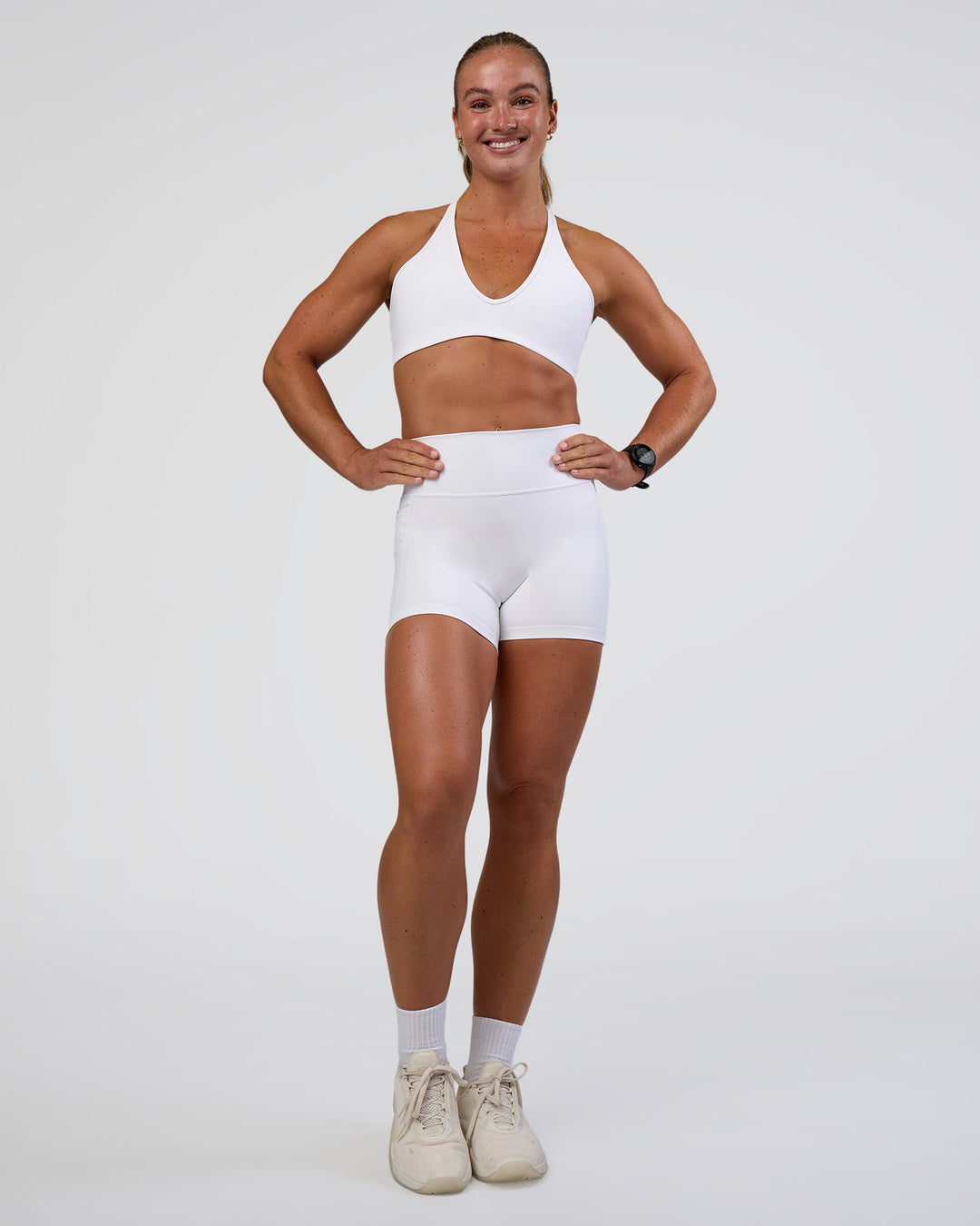 Woman wearing Fusion Ultra High-Rise 4" Short Pockets - White | Model:Sav | Size:S