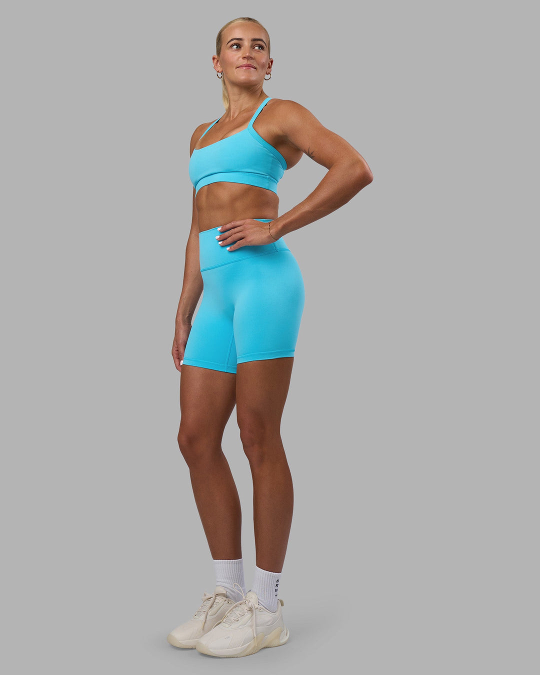 Woman wearing Fusion Ultra High-Rise 6&quot; Short - Blue Atoll | Model:Katie | Size:S