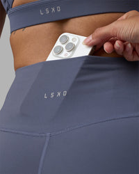 Woman wearing Fusion Ultra High-Rise 6" Short - Night Shadow | Model:Rhiley | Size:S