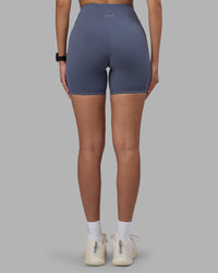 Woman wearing Fusion Ultra High-Rise 6" Short - Night Shadow | Set:true | Angle:back | Model:Rhiley | Size:S