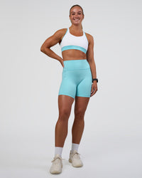 Woman wearing Fusion Ultra High-Rise 6" Short Pockets - Baltic Sea | Model:Sav | Size:S