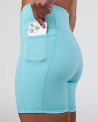 Woman wearing Fusion Ultra High-Rise 6" Short Pockets - Baltic Sea | Set:true | Angle:closeup | Model:Sav | Size:S
