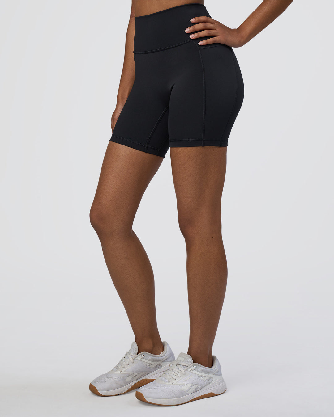 Woman wearing Fusion Ultra High-Rise 6" Short Pockets - Black | Model:Jordan | Size:S