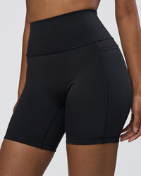 Woman wearing Fusion Ultra High-Rise 6" Short Pockets - Black | Model:Jordan | Size:S