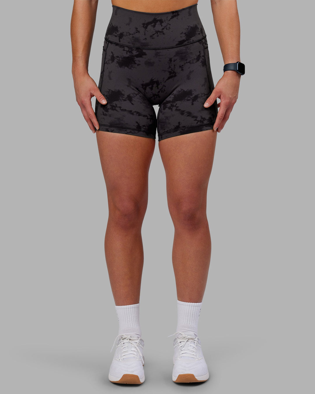 Woman wearing Fusion Ultra High-Rise 6&quot; Short Pockets - Black Tie Dye | Model:Keisha | Size:S