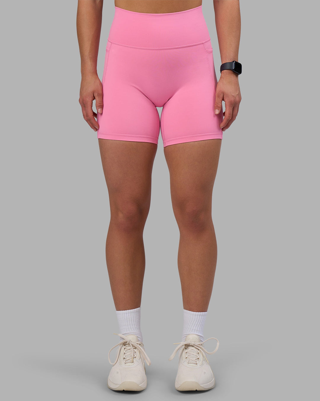 Woman wearing Fusion Ultra High-Rise 6&quot; Short Pockets - Candy Pink | Model:Keisha | Size:S