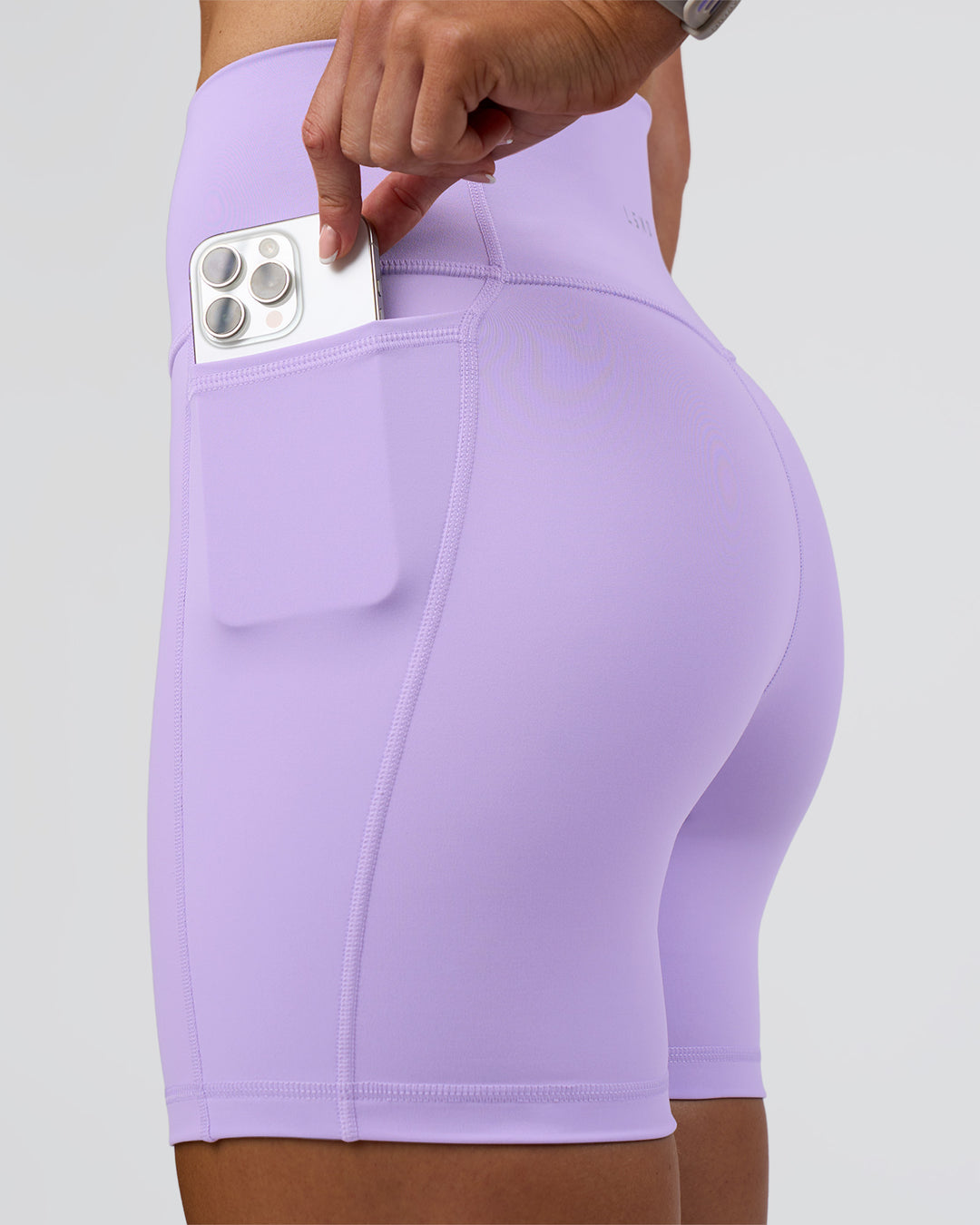 Woman wearing Fusion Ultra High-Rise 6&quot; Short Pockets - Pale Lilac | Model:Emelia | Size:S