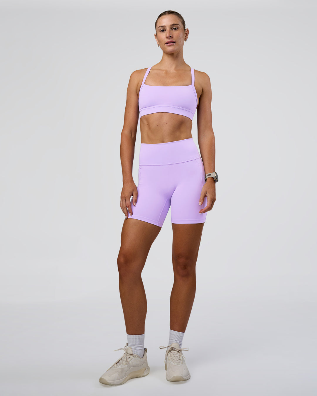 Woman wearing Fusion Ultra High-Rise 6&quot; Short Pockets - Pale Lilac | Model:Emelia | Size:S
