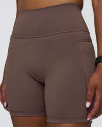 Woman wearing Fusion Ultra High-Rise 6" Short Pockets - Peppercorn | Model:Rica | Size:S