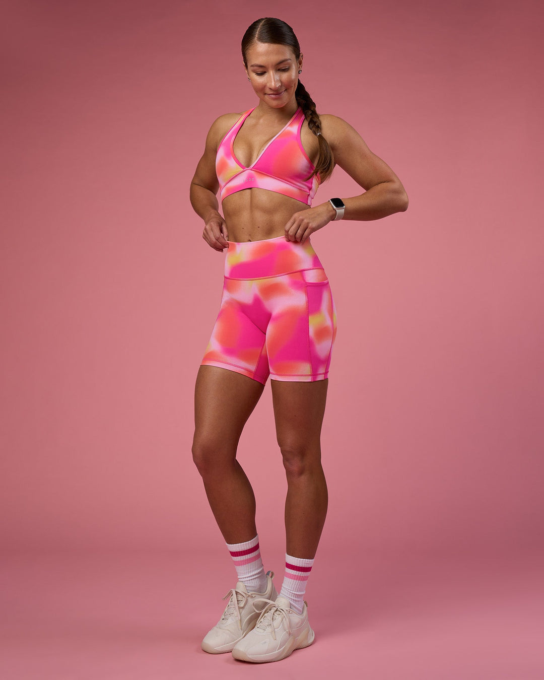 Woman wearing Fusion Ultra High-Rise 6&quot; Short Pockets - Pink Glow Print | Model:Hannah | Size:S