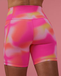 Woman wearing Fusion Ultra High-Rise 6" Short Pockets - Pink Glow Print | Model:Hannah | Size:S