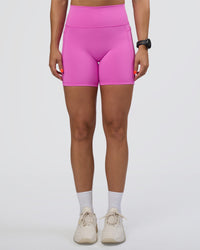 Woman wearing Fusion Ultra High-Rise 6" Short Pockets - Ultra Fuchsia | Model:Abbey | Size:S