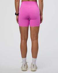 Woman wearing Fusion Ultra High-Rise 6" Short Pockets - Ultra Fuchsia | Model:Abbey | Size:S