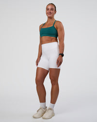 Woman wearing Fusion Ultra High-Rise 6" Short Pockets - White | Model:Sav | Size:S