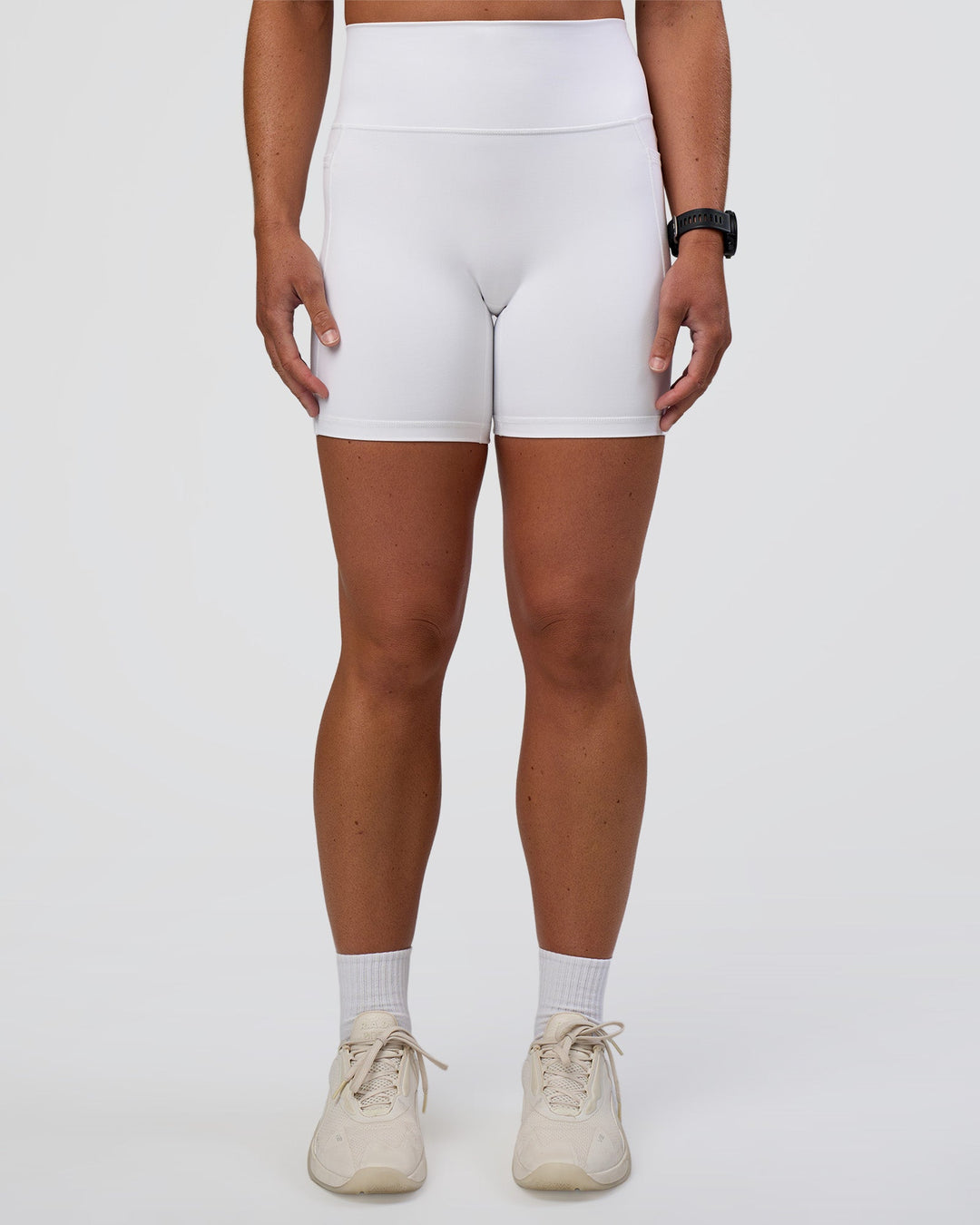 Woman wearing Fusion Ultra High-Rise 6" Short Pockets - White | Model:Sav | Size:S