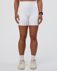 Woman wearing Fusion Ultra High-Rise 6" Short Pockets - White | Model:Sav | Size:S