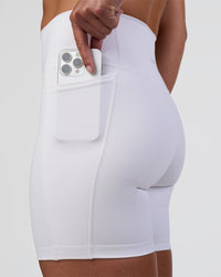 Woman wearing Fusion Ultra High-Rise 6" Short Pockets - White | Model:Sav | Size:S