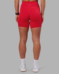 Woman wearing Fusion Ultra High-Rise 6" Short - Scarlet | Set:true | Angle:back | Model:Keisha | Size:S