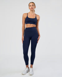 Woman wearing Fusion Ultra High-Rise 7/8 Legging - Future Navy | Model:Evie | Size:S