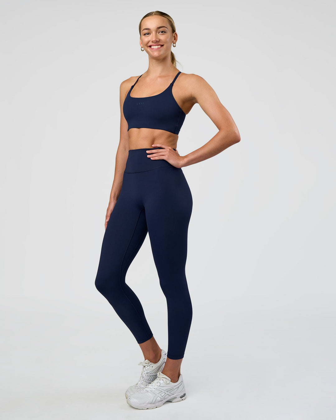 Woman wearing Fusion Ultra High-Rise 7/8 Legging - Future Navy | Model:Evie | Size:S