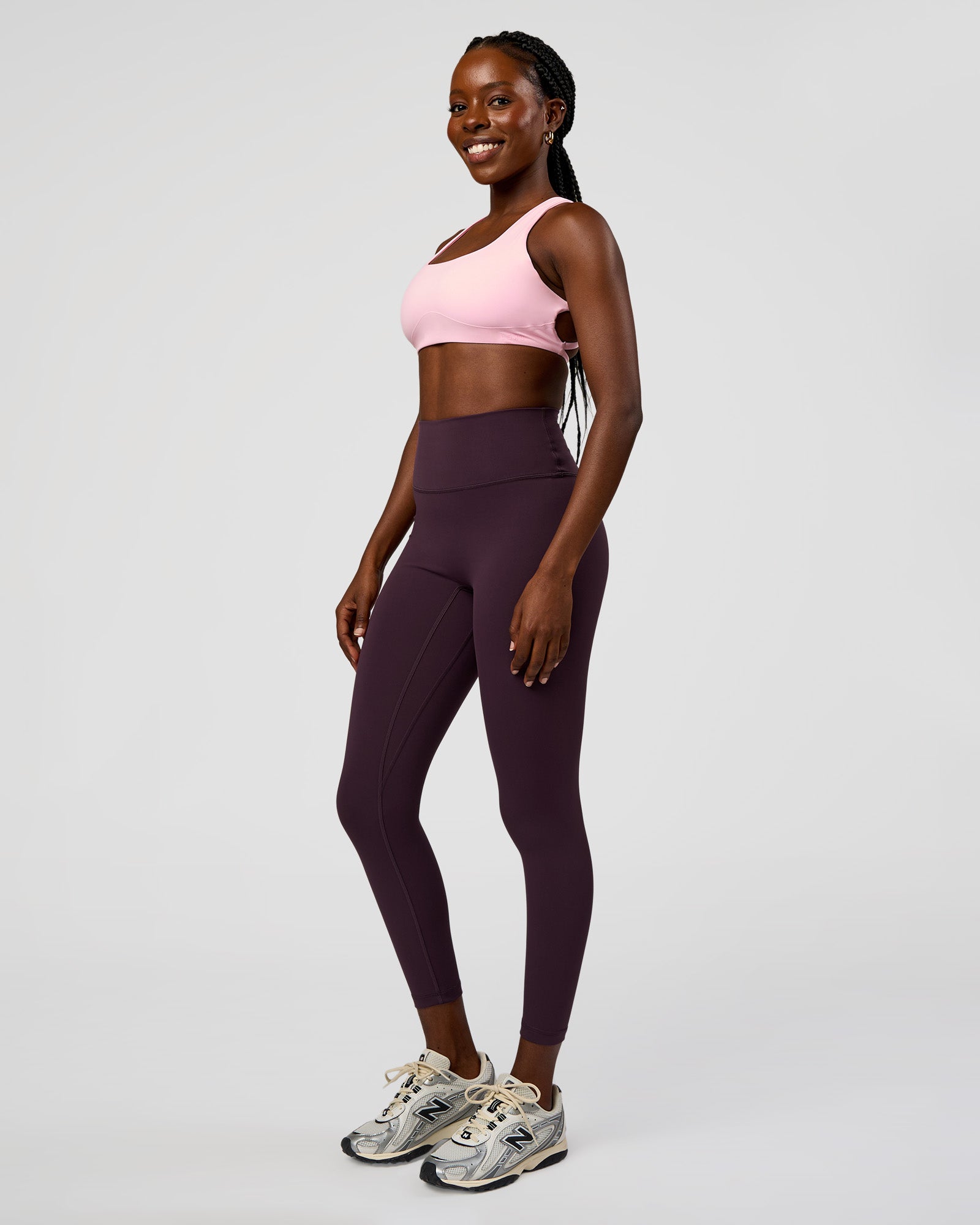 Woman wearing Fusion Ultra High-Rise 7/8 Legging - Midnight Plum | Model:Ellie | Size:S