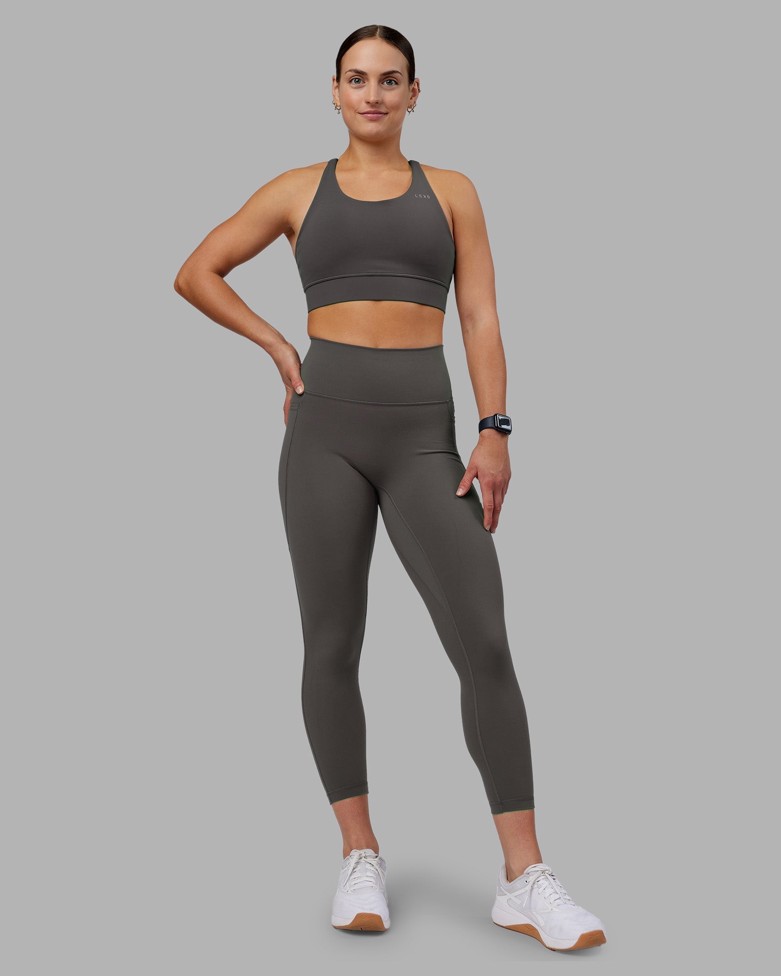 Woman wearing Fusion Ultra High-Rise 7/8 Legging Pockets - Dark Storm | Model:Keisha | Size:S