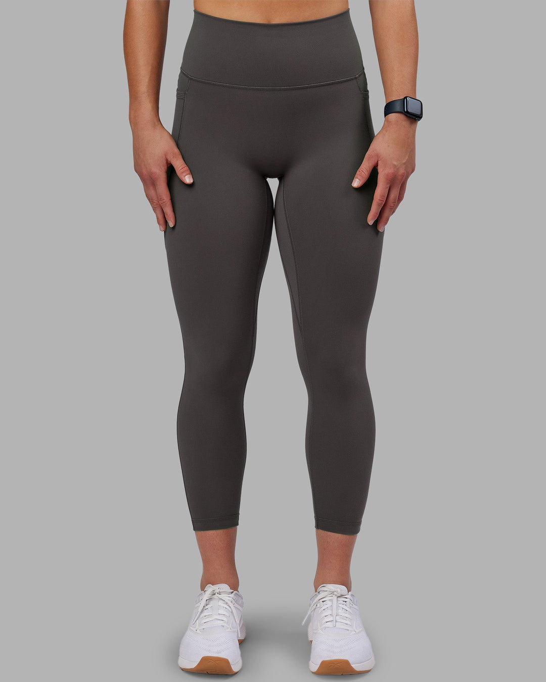 Woman wearing Fusion Ultra High-Rise 7/8 Legging Pockets - Dark Storm | Model:Keisha | Size:S