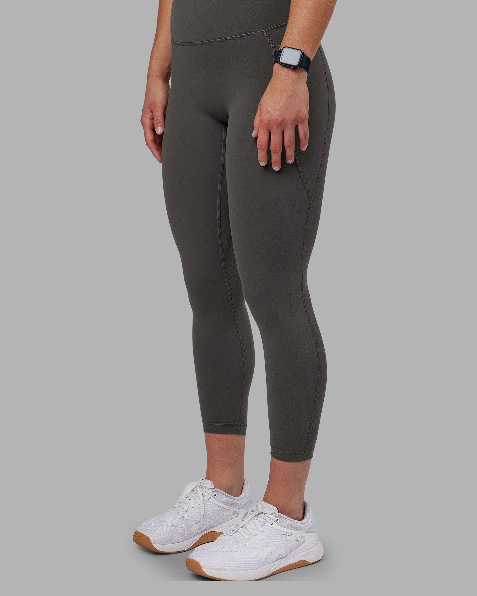 Woman wearing Fusion Ultra High-Rise 7/8 Legging Pockets - Dark Storm | Model:Keisha | Size:S