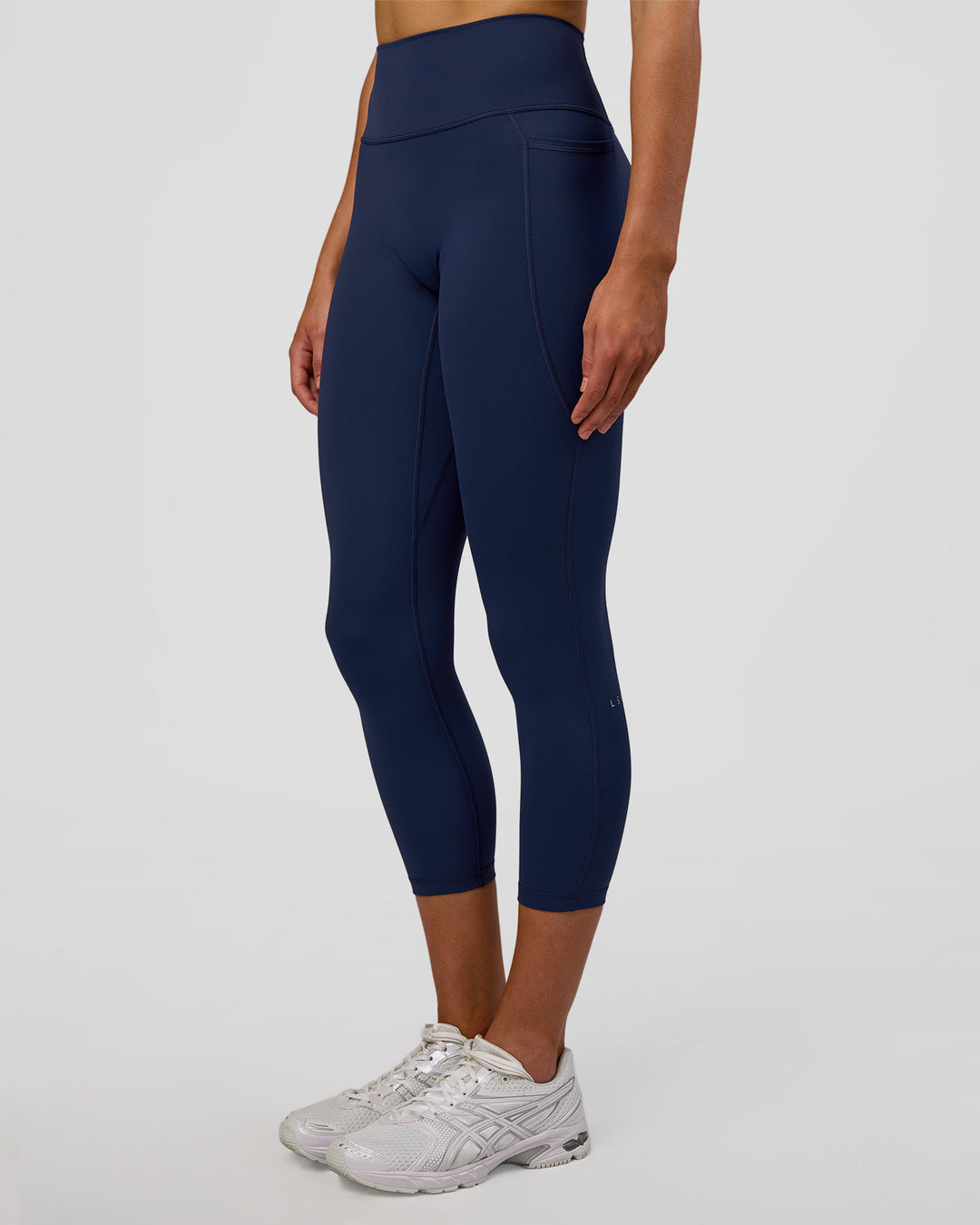 Woman wearing Fusion Ultra High-Rise 7/8 Legging Pockets - Future Navy | Model:Evie | Size:S