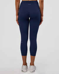 Woman wearing Fusion Ultra High-Rise 7/8 Legging Pockets - Future Navy | Model:Evie | Size:S