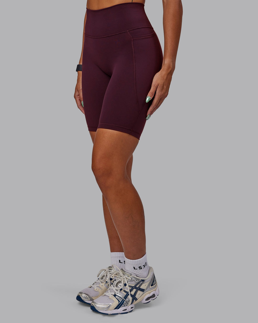 Woman wearing Fusion Ultra High-Rise 9&quot; Short Pockets - Cherry Lacquer | Model:Vanessa | Size:S