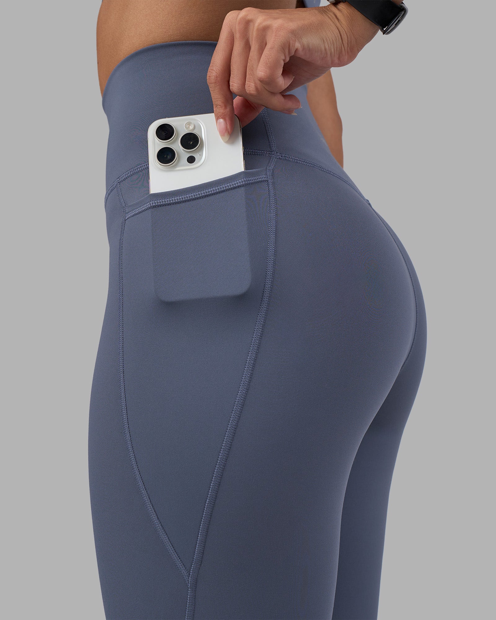 Woman wearing Fusion Ultra High-Rise 9" Short Pockets - Night Shadow | Model:Rhiley | Size:S