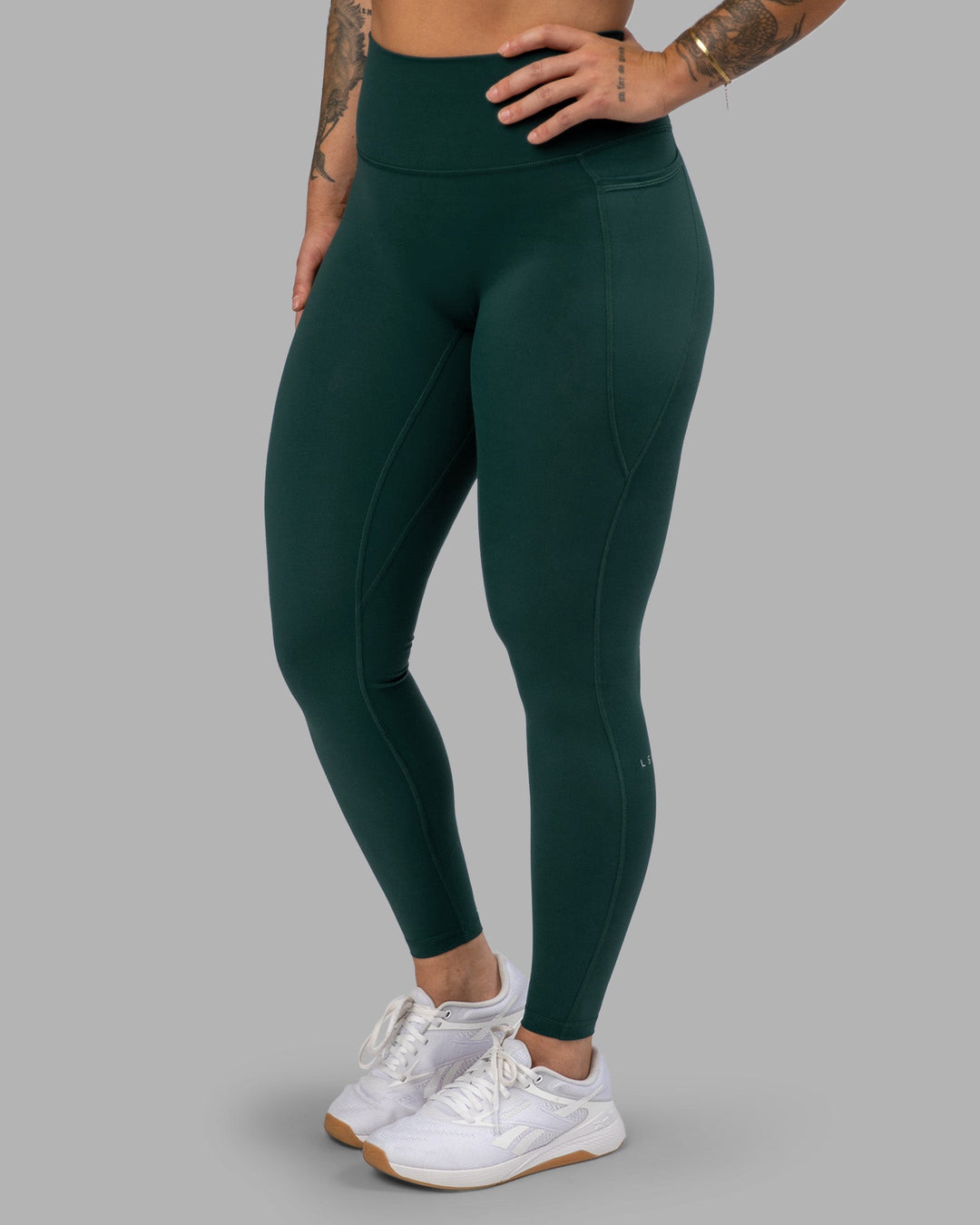 Woman wearing Fusion Ultra High-Rise Full Length Legging Pockets - Dark Moss | Model:Robyn | Size:S