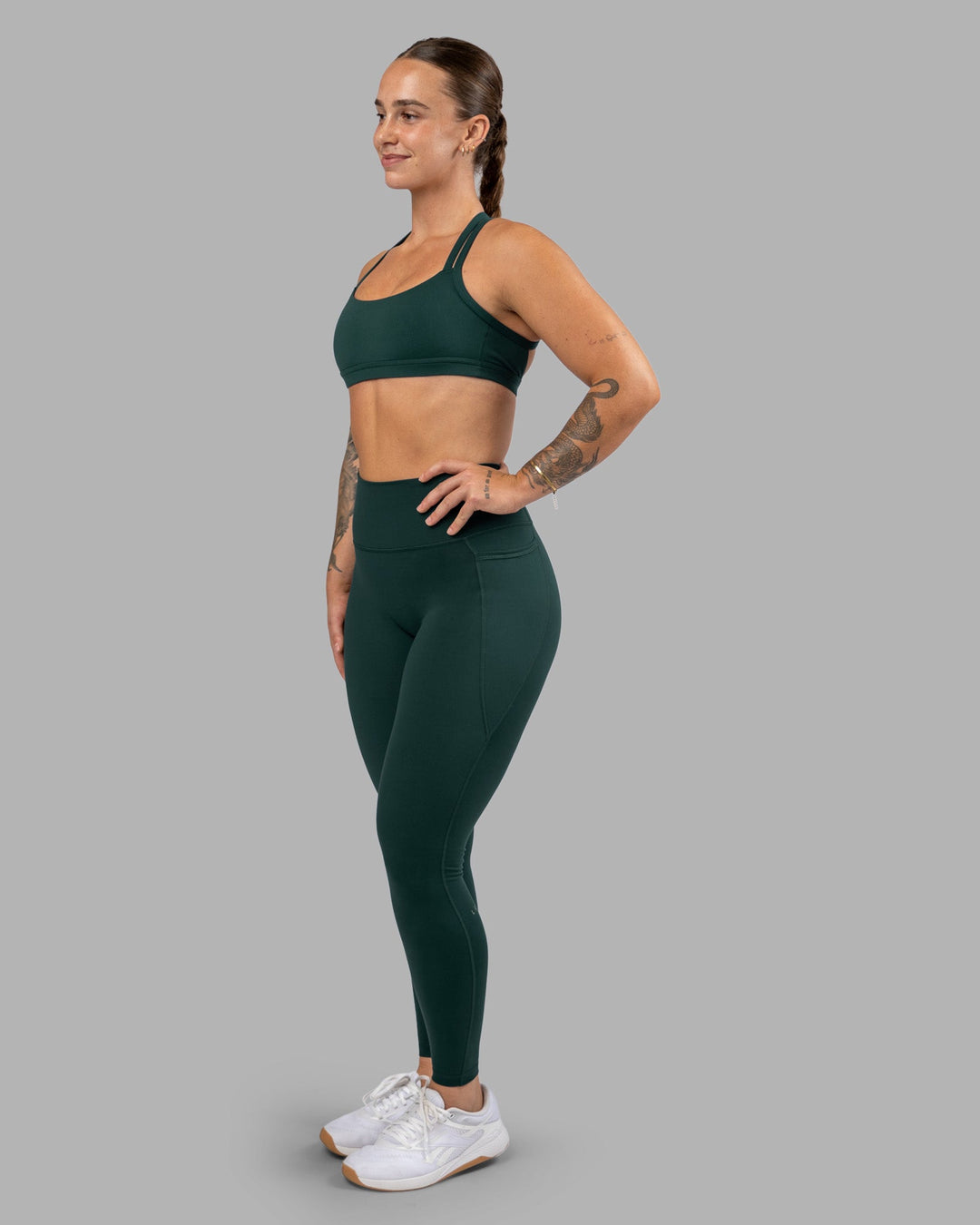 Woman wearing Fusion Ultra High-Rise Full Length Legging Pockets - Dark Moss | Model:Robyn | Size:S