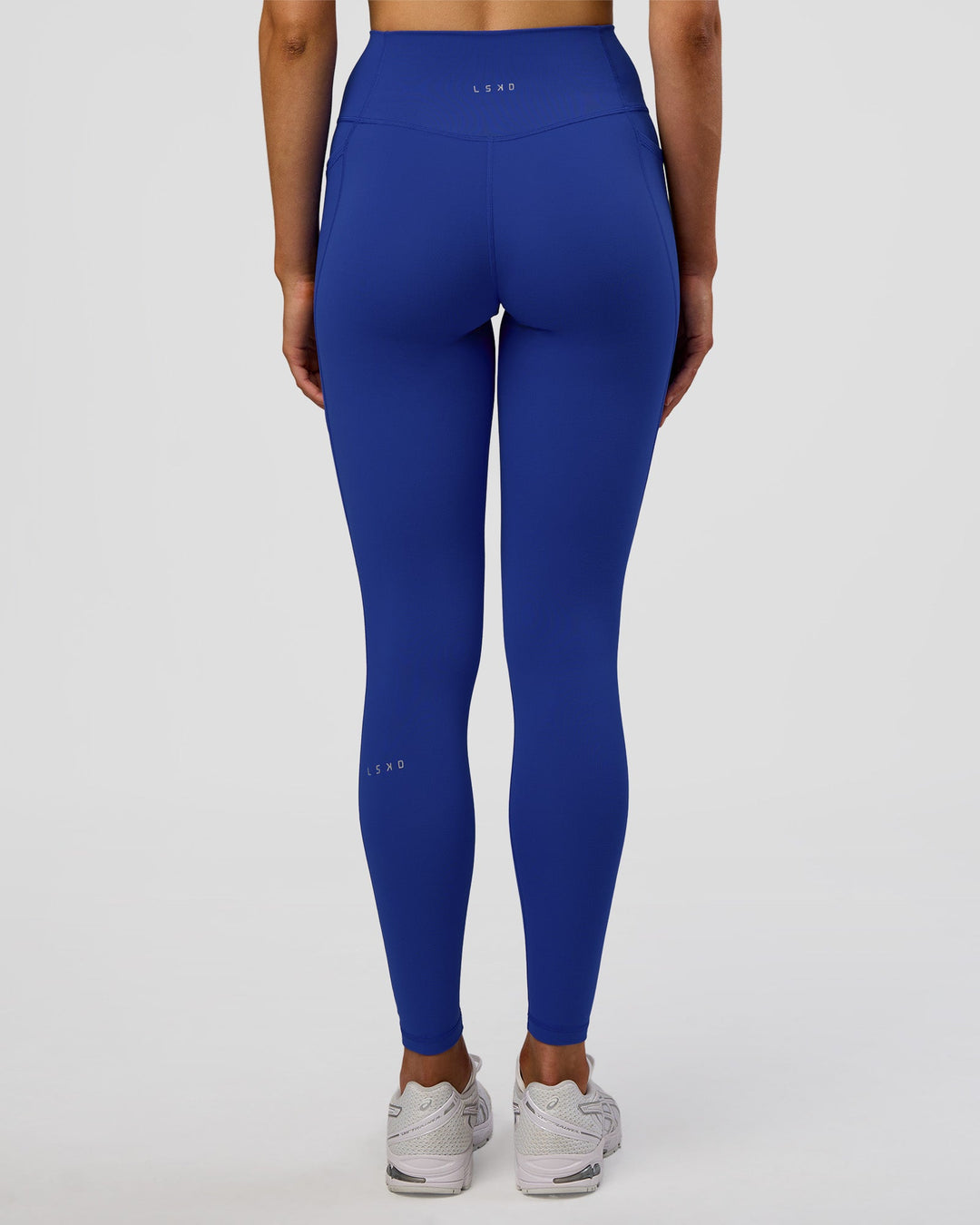 Woman wearing Fusion Ultra High-Rise Full Length Legging Pockets - Electric Indigo | Model:Evie | Size:S